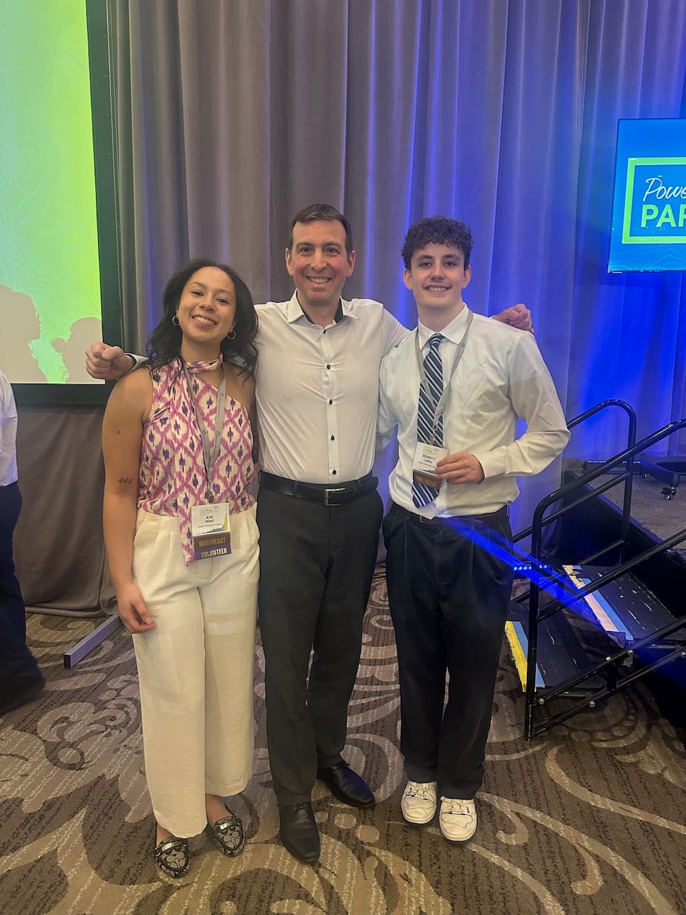 Bennett Lewis and Ava West at the 2025 National Engineers Without Borders Conference with Boris Martin