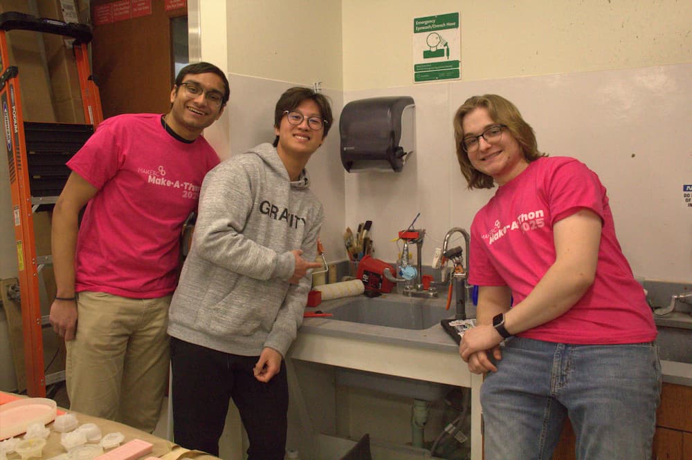 Water waste team demonstrating their project. 