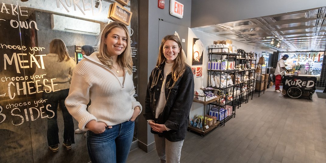 Kured founders inside their store
