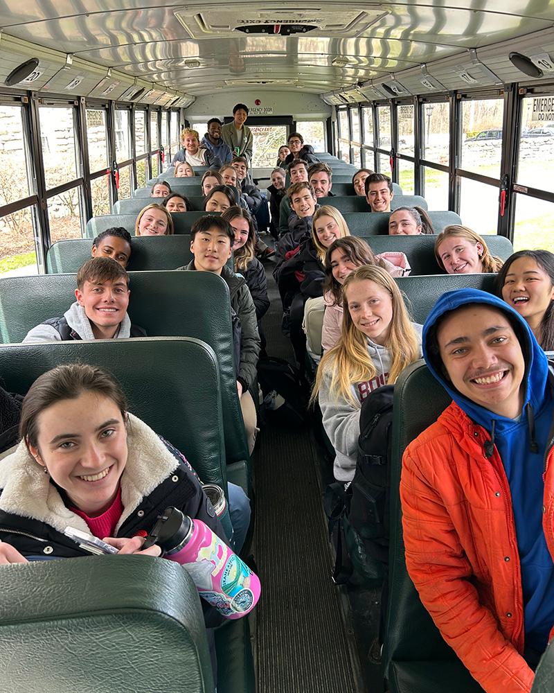 Students riding the bus to Halftime