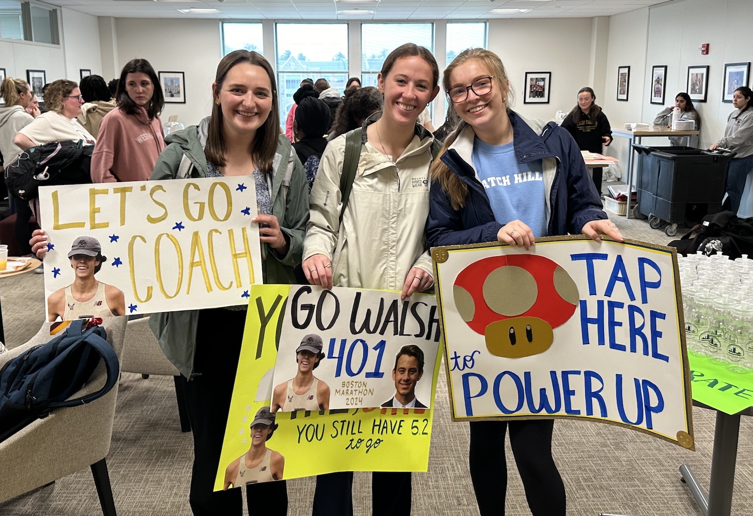 Students holding signs