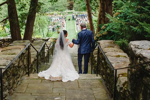 Father and daughter approaching Cecelia's Garden