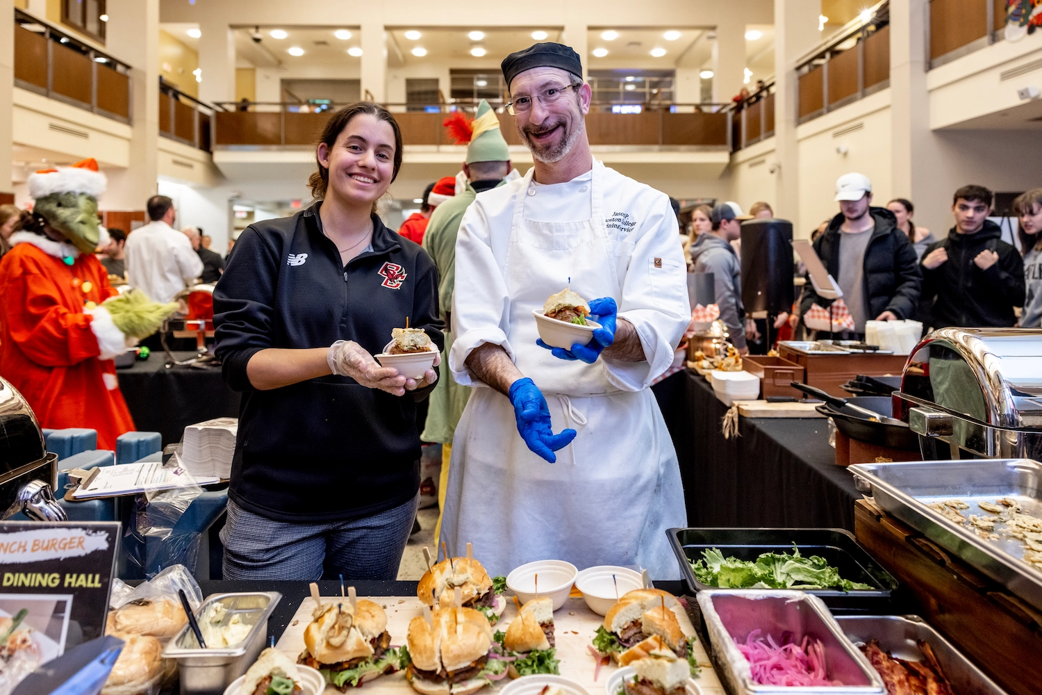 Staff and students enjoying a burger competition in a BC dining hall.