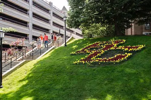 Three students in residence hall talking