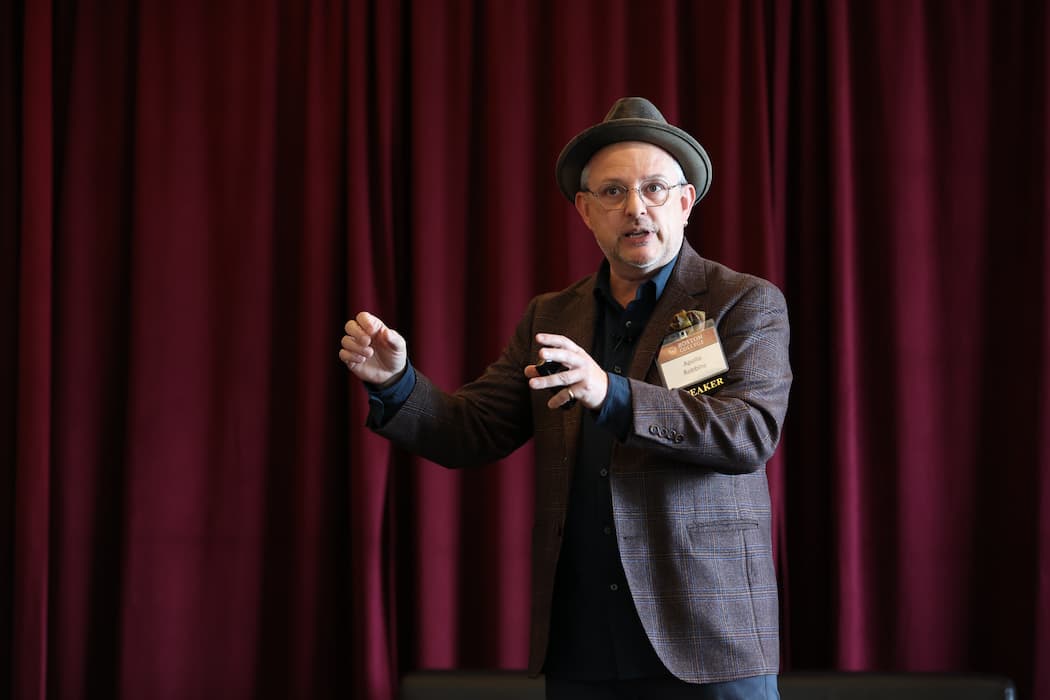 Apollo Robins on stage at the finance conference. 
