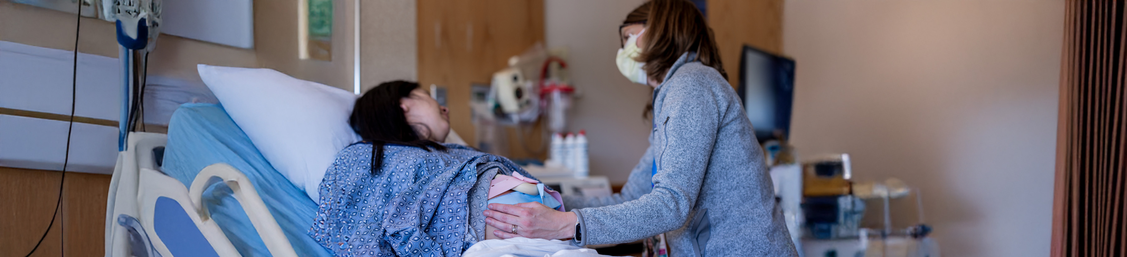 A midwife cares for a patient