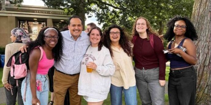 students smiling at bbq