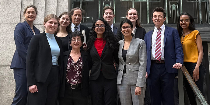Professor Reena Parikh with students and colleagues outside courthouse