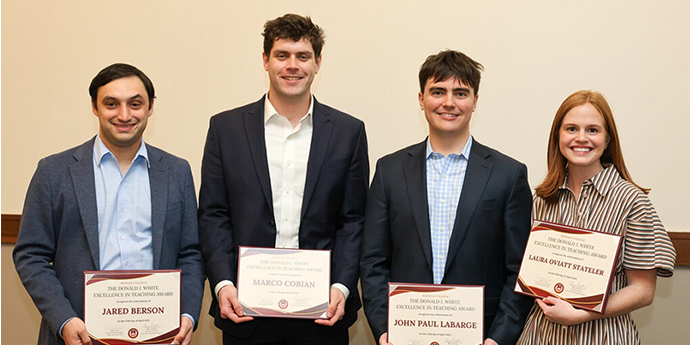 four students with awards