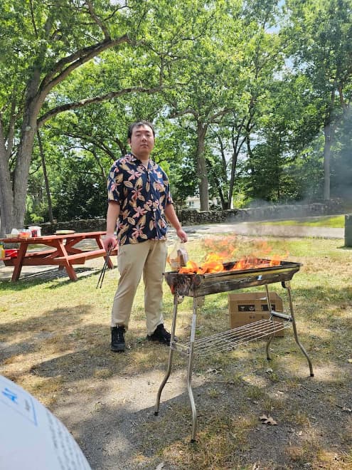 Lihao Feng at a grill.