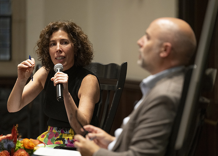 Rocío Calvo asks Cristiano Casalini a question in 100 Gasson Hall.
