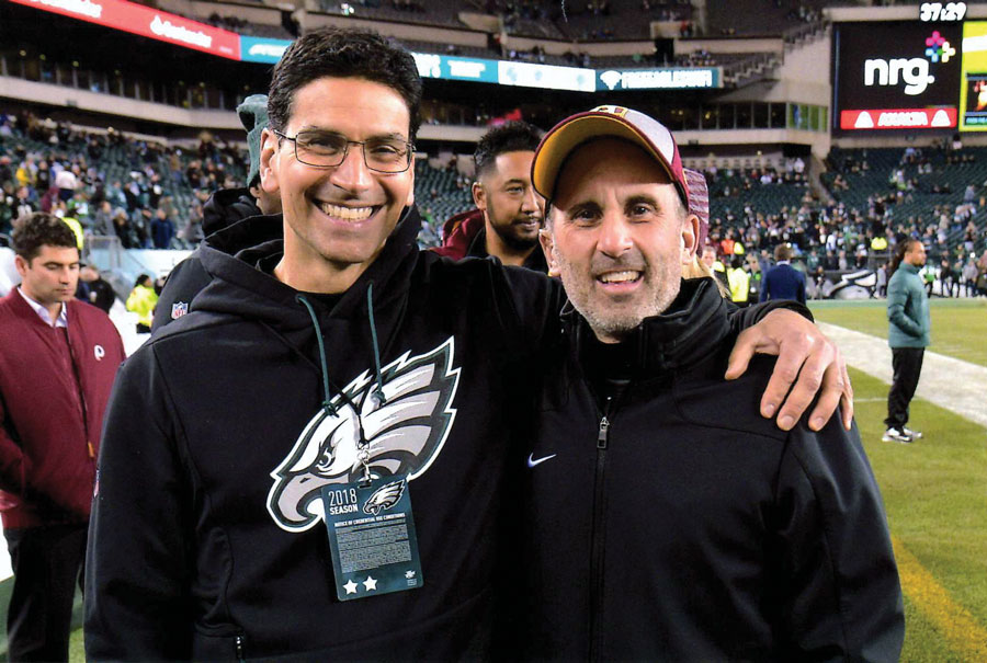 Matt Pepe and Chris Annunziata on the sidelines of a football field