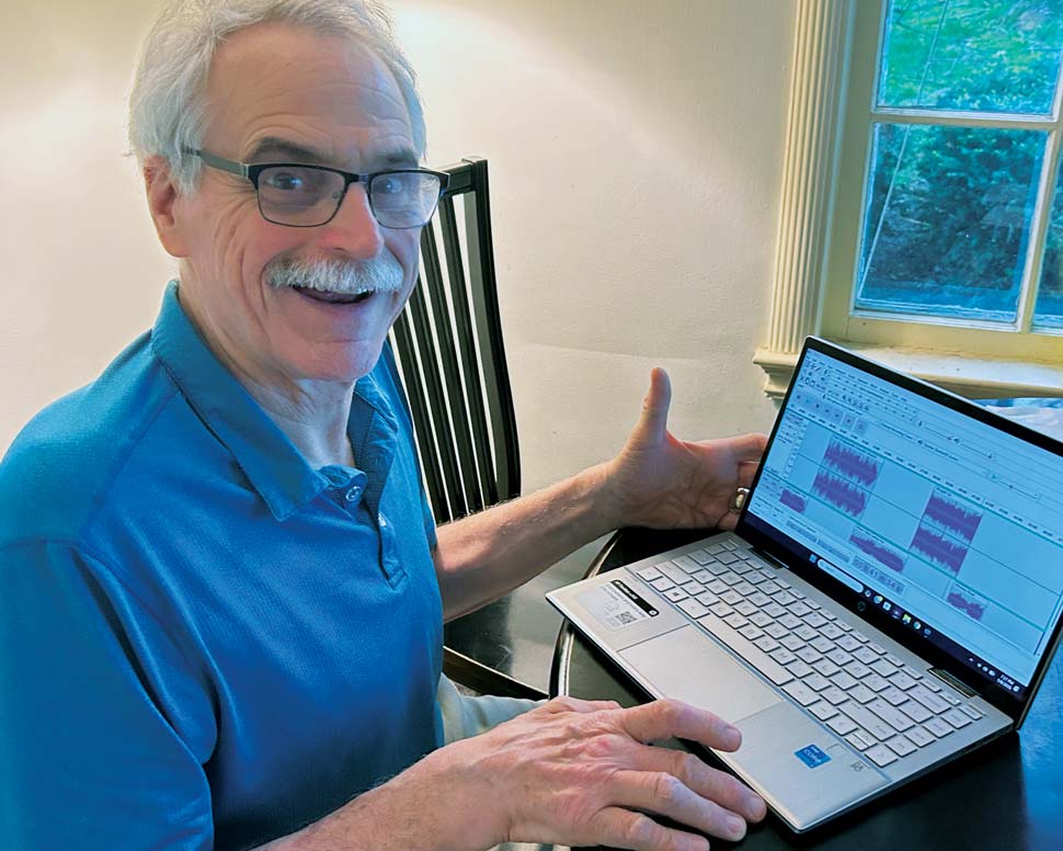 Hauenstein photographed producing show with laptop in his home