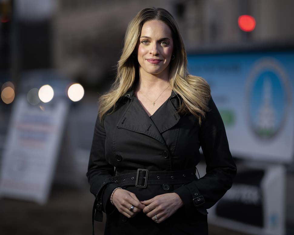 Rex photographed on sidewalk at dusk