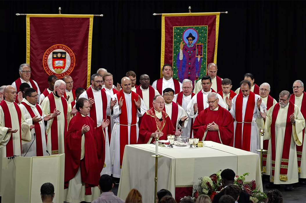 Priests celebrating Mass at Conte Forum