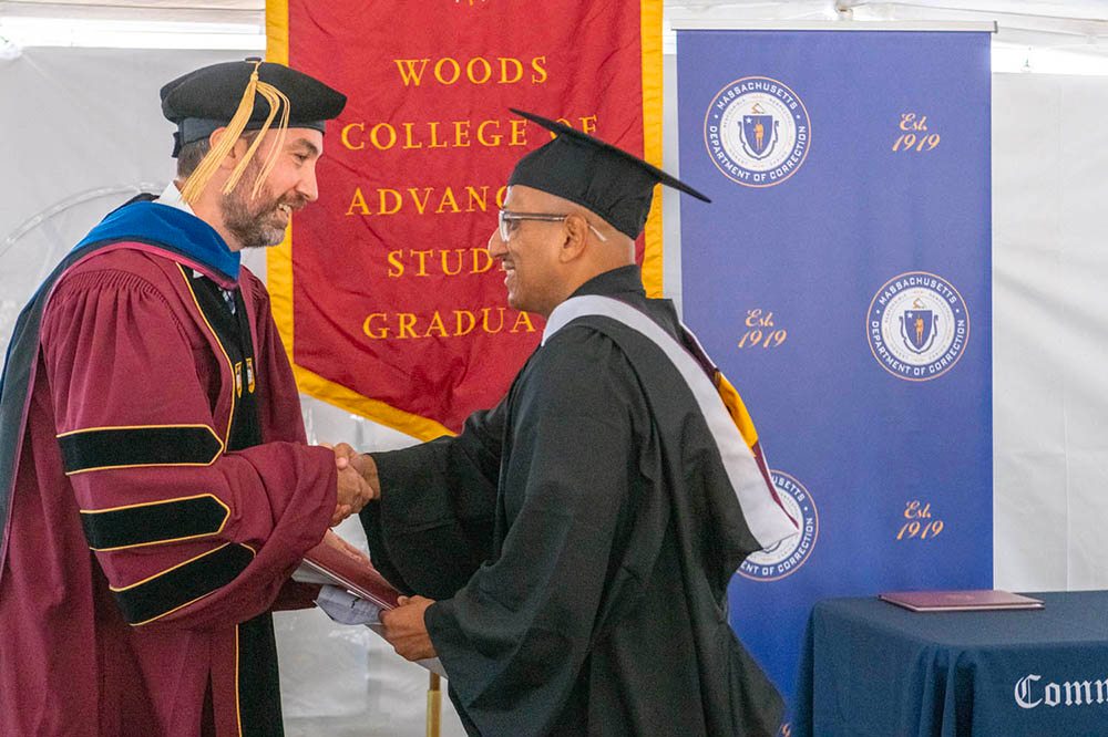 Graduate Joel Vasquez receives his diploma.