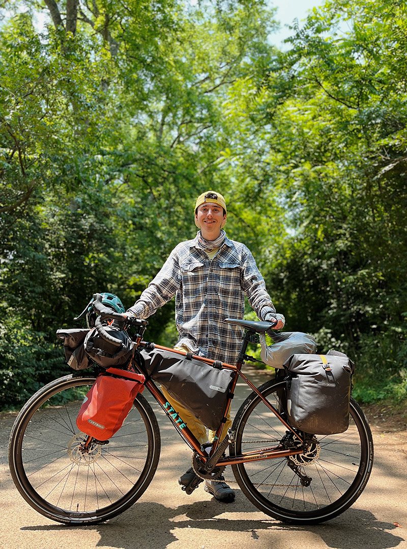 Lucas Beyer standing with his bike