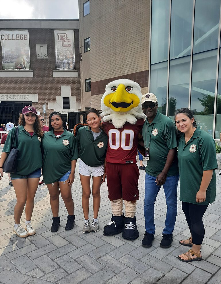 A group of people wearing green shirts with Baldwin
