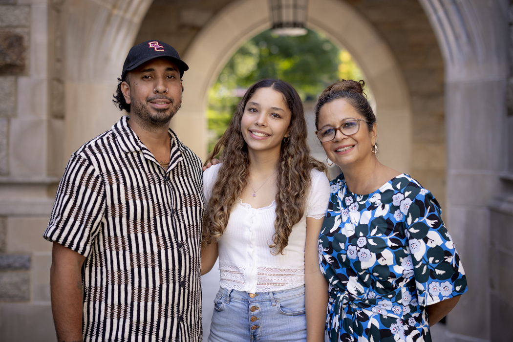 Tatiyana Orrego ’29, flanked by her father, Alex,  and grandmother Claudia.