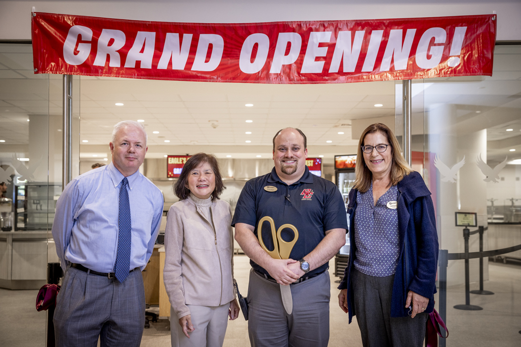 Dining Services staff and a 'grand opening' banner
