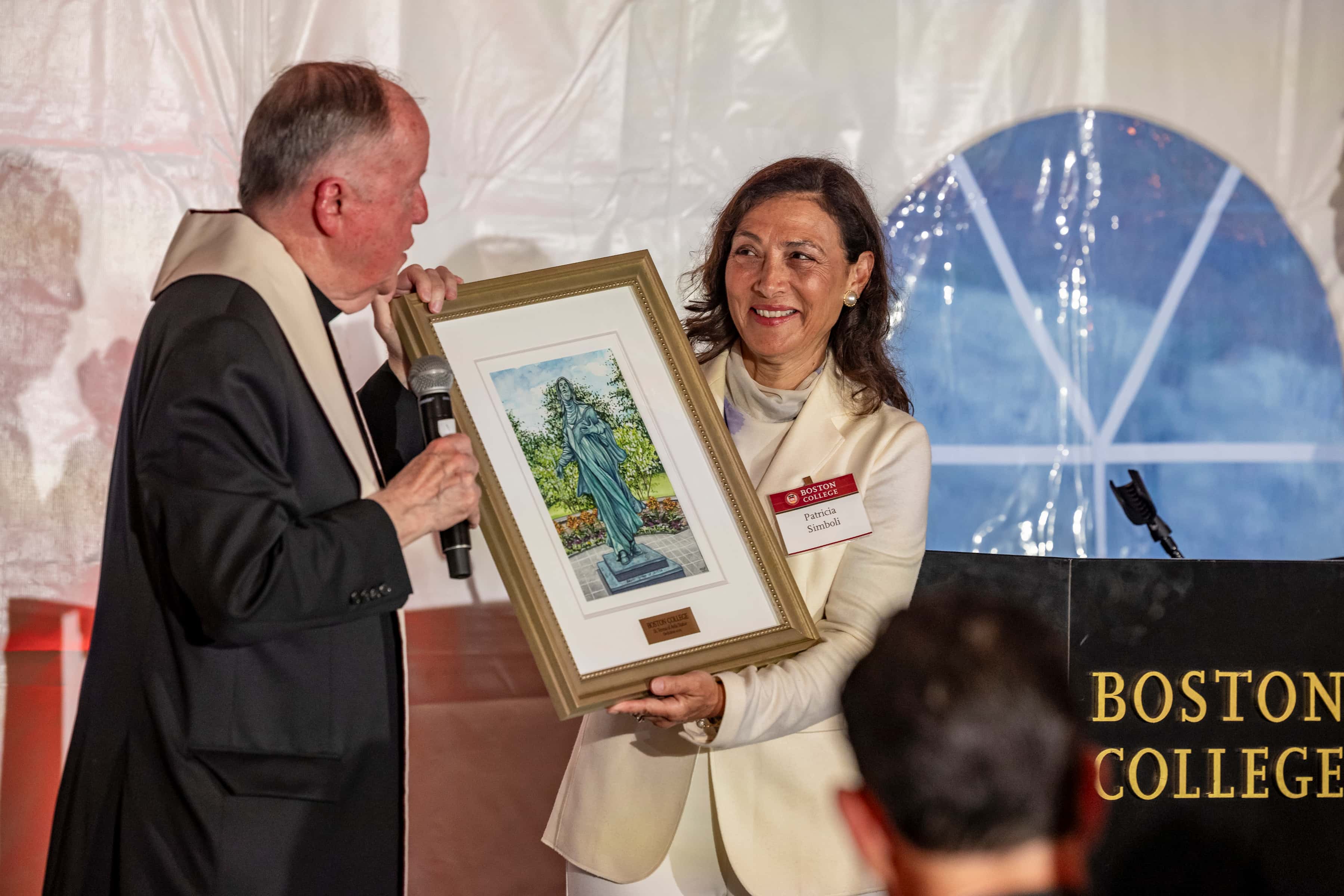 Fr. Leahy presented a framed photo of the garden to Patricia Simboli at the dedication event on September 25.