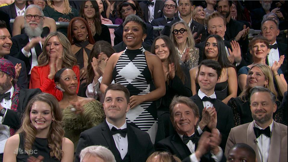 A crowd of people in a studio audience
