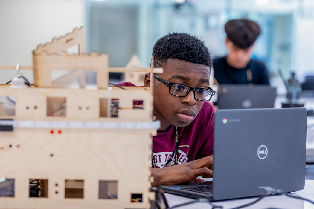 student at work on a model