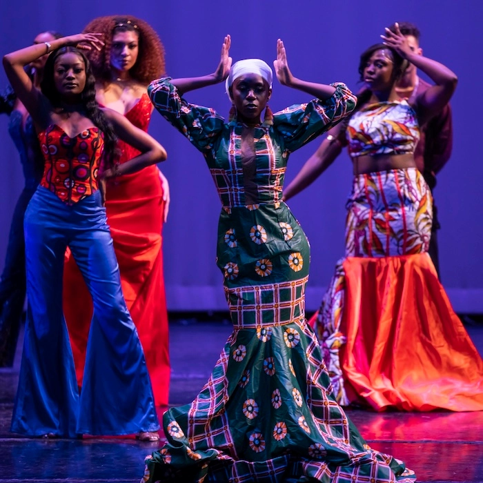 Student on stage during a fashion show