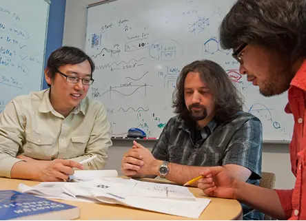 Faculty members talking