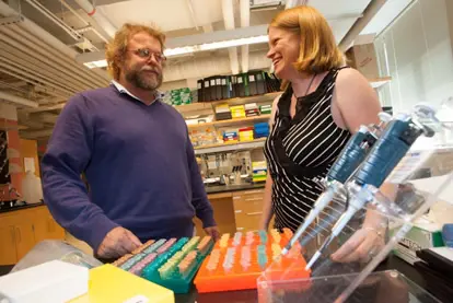 Researcher and student in laboratory